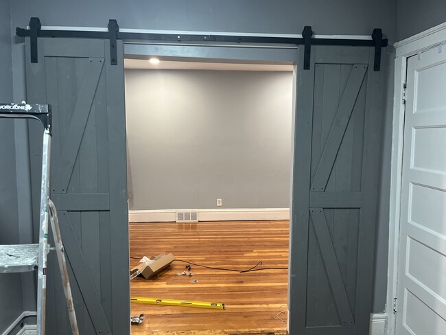 Barn doors to living room - 79 Florida St