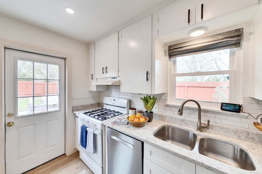 Rear entry door off the kitchen leads to the back patio - 2102 Bristol Dr