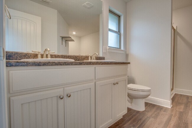 Building Photo - Spacious 4BR/2BA Brick Home with 2-Car Garage, Granite Kitchen, Vaulted Ceilings & Fully Fenced B...