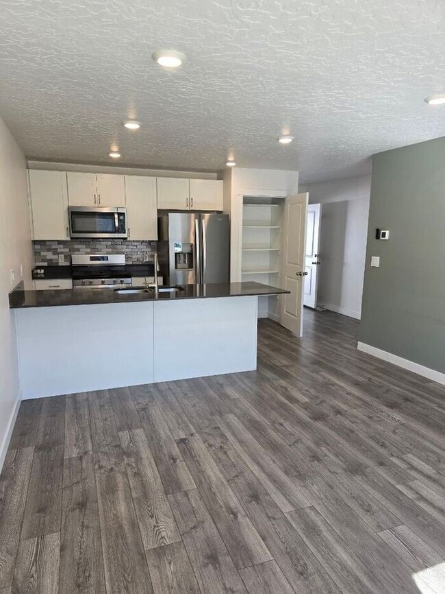 Building Photo - Nearly New, Well Appointed Modern Townhouse w 2 car attached garage