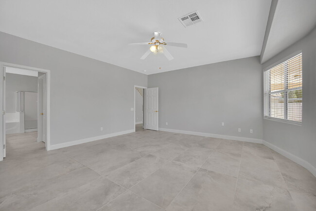 Building Photo - Spacious 4-bedroom, 3-car garage home feat...