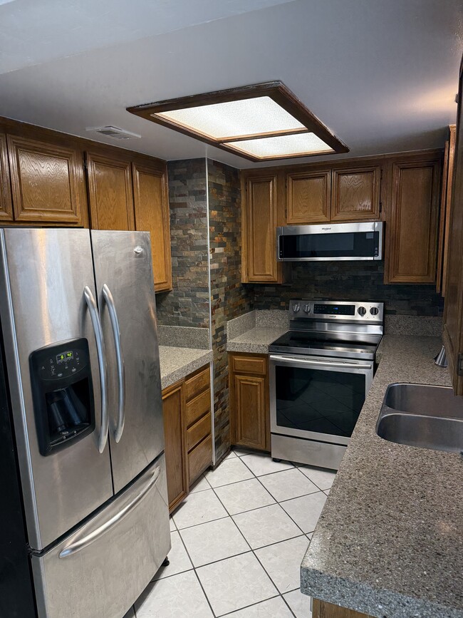 Kitchen with Stainless steel appliances - 200 Elm Ave