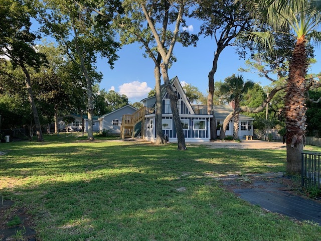 Back view of fenced yard and both units - 1561 US-98