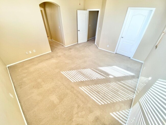 Building Photo - THIS SPACIOUS RESIDENCE FEATURES 4 BEDROOM...