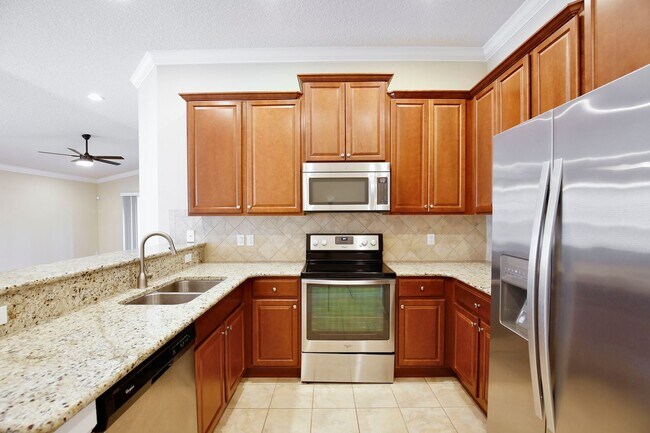 Building Photo - Gorgeous 2/2 + Den Mediterranean Villa with Waterfront Screened Patio and 2-Car Garage in the Pre...
