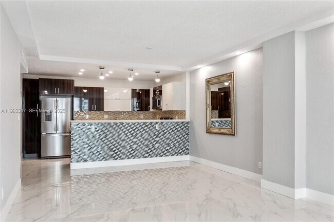 Building Photo - 19380 Collins Ave