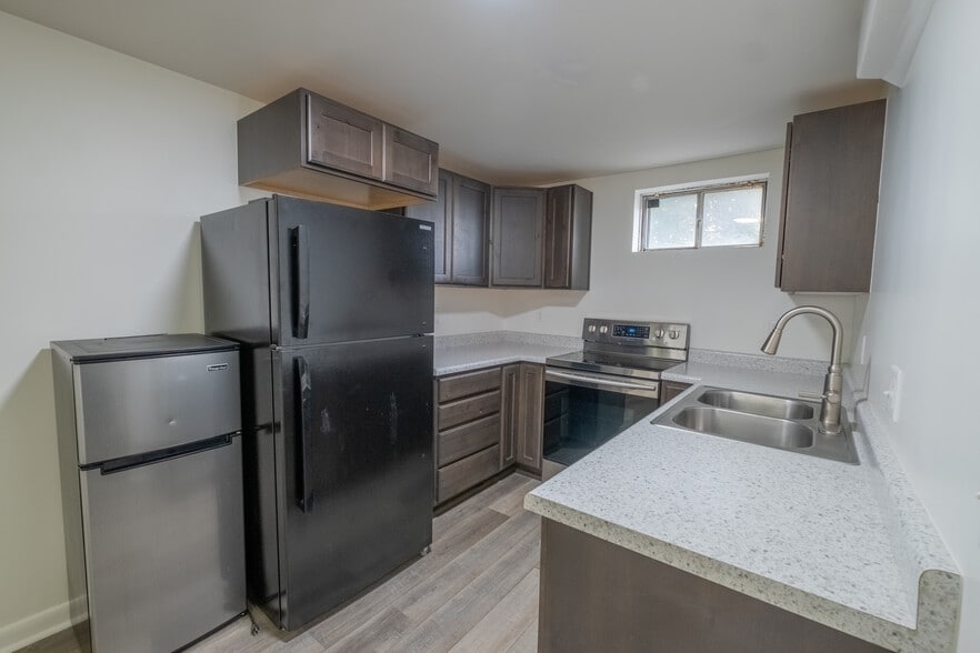 Kitchen comes with two fridges to use and a dishwasher. - 1415 Concord St