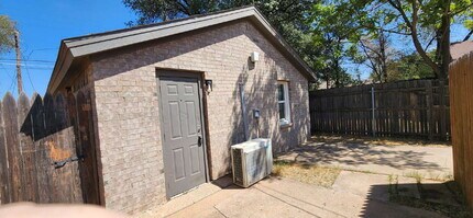 Building Photo - Half Off First Full Month's Rent! Rear Home Nestled In Texas Tech and Downtown Metro Area