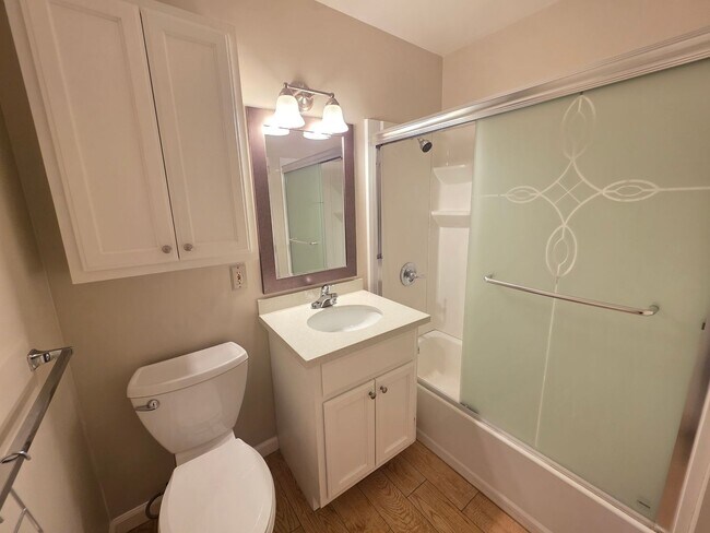Building Photo - Spacious 2BR Condo with Central A/C, Bonus Room & Huge Storage – Walk to Burlingame Avenue
