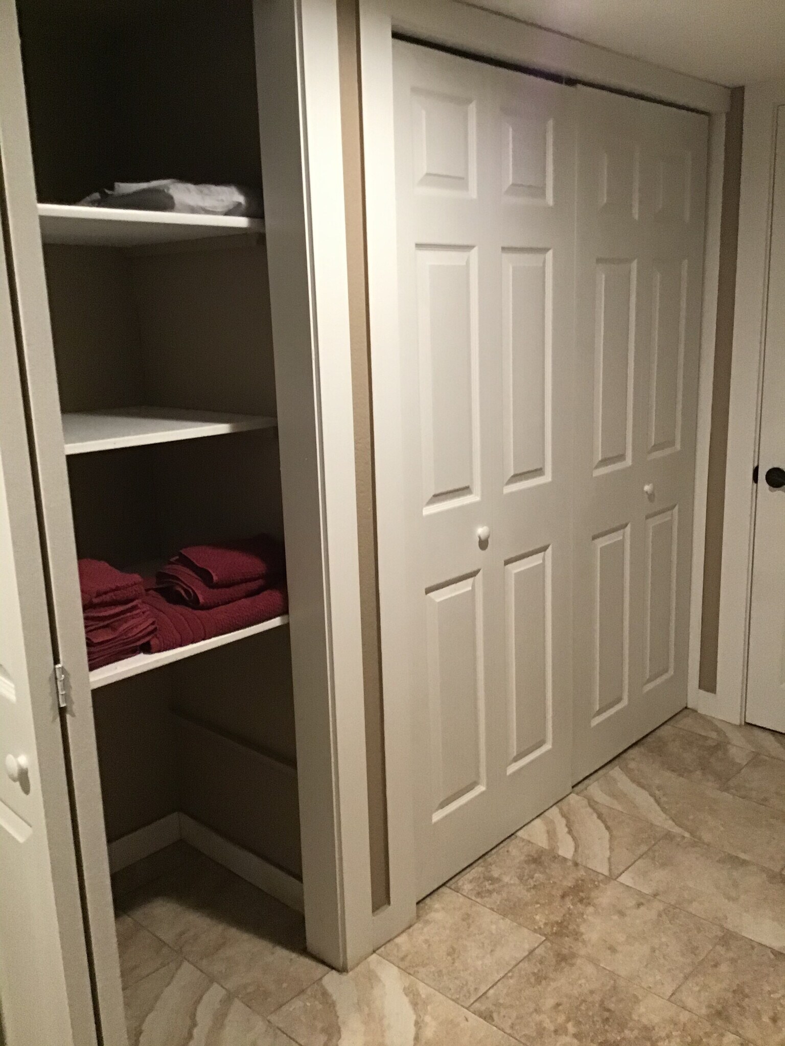 Large folding door closets with shelves. - 17405 Ashworth Ave N