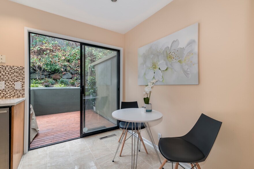 Breakfast table next to the kitchen looking out to the back patio. - 1604 Lakeview Blvd E