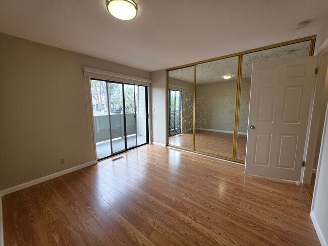 Building Photo - Spacious 2BR Condo with Central A/C, Bonus Room & Huge Storage – Walk to Burlingame Avenue