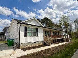 Entrance area with designated parking spaces - 111 Buster Ln