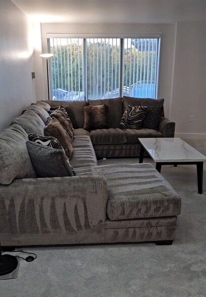 sectional/sleeper couch and coffee table - 10201 Grosvenor Plz