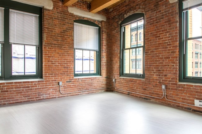 Reclaimed brick. Oversized windows. Abundant natural light. - 381 Congress Lofts