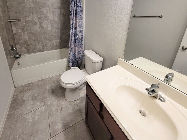 Building Photo - BEAUTIFUL 3 BEDROOM 2 BATH HOME WITH NO BACKYARD NEIGHBORS. TALL TREES AS YOU LOOK FROM THE COVER...