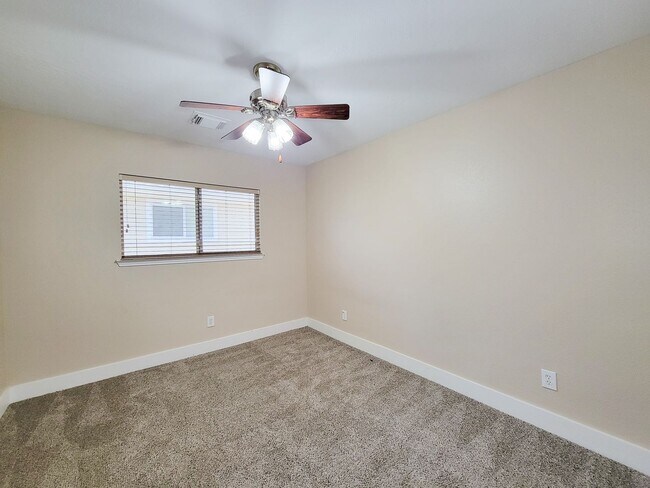 Building Photo - 3 bedroom one story home on large corner lot. Home has hard flooring throughout living areas and ...