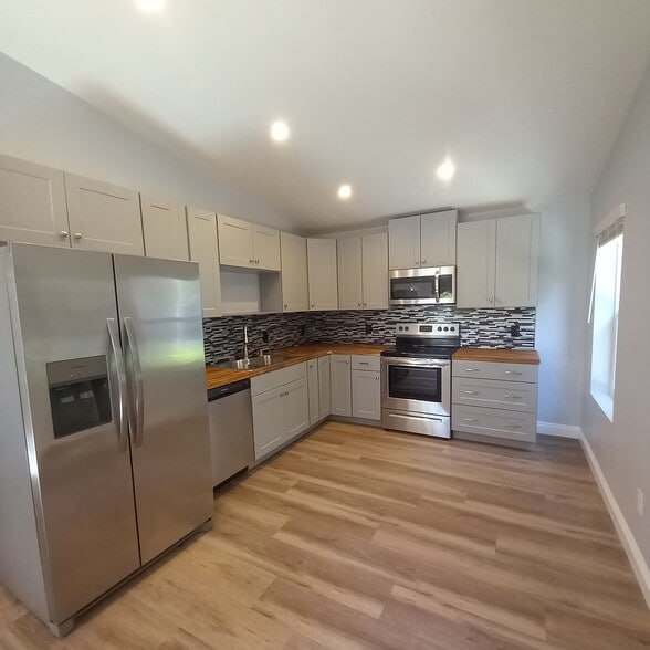 Beautiful kitchen with new stainless steel appliances, butcher block countertops - 3640 Catalina Dr