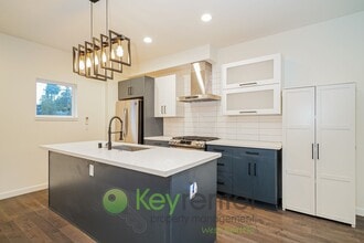 Building Photo - Rooftop Living with Open Concept Design and Parking Included