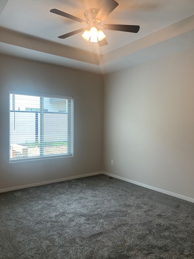 Building Photo - Walkout ranch townhome with 2 stall garage...