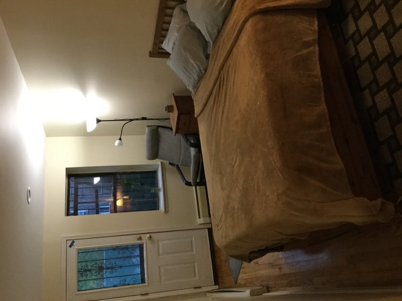 Brown bedroom w/ backyard access - 507 W 173rd St