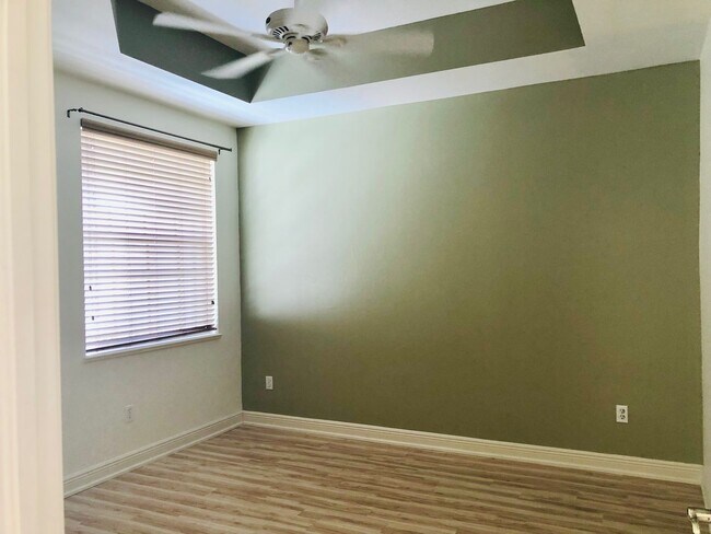 Building Photo - Experience Bell Tower Park. GATED ground floor 2 Bed 2 Bath Den 1 Car Garage Condo.