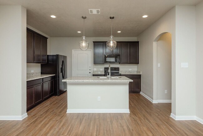 Building Photo - Live, love, and grow in this charming townhome!