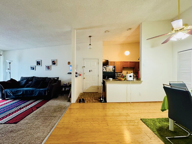 View of dining, kitchen, living room, and front door. - 2280 S Oswego Way