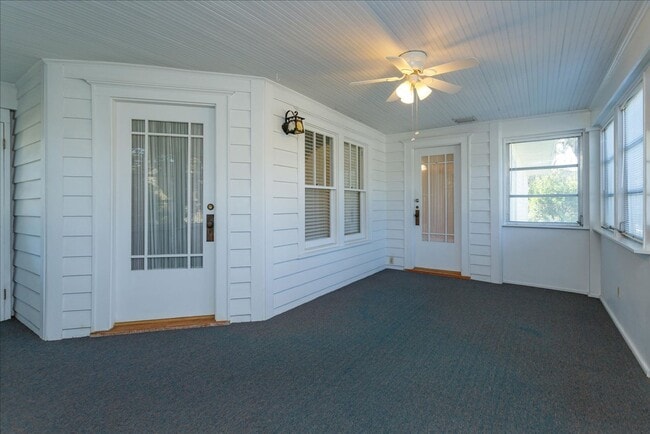 Building Photo - Run don't walk for this one of a kind beautifully maintained Old Florida Charmer on a park like d...