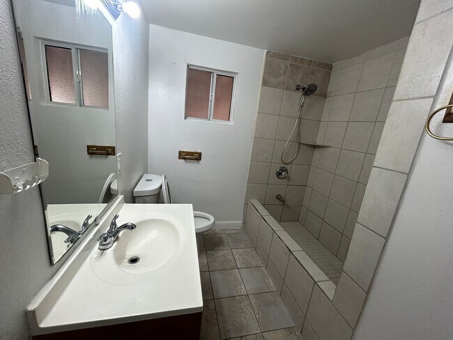 Building Photo - Single story home with large backyard and huge carport with plenty of storage.
