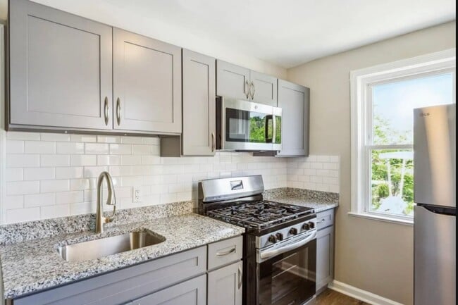 Building Photo - Fully Renovated Two-Bedroom Townhome In Du...