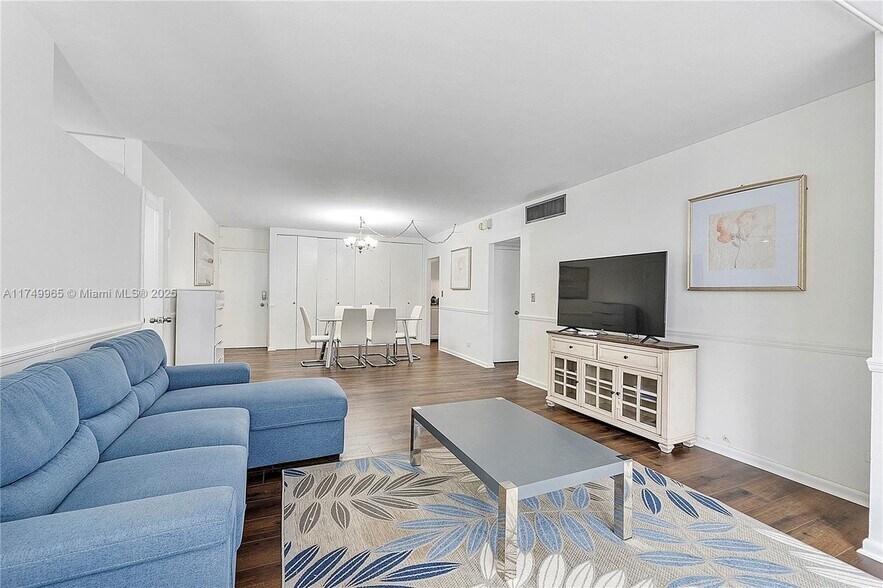 living area with TV - 5005 Collins Ave