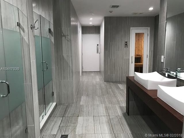 pool deck showers and saunas - 3180 S Ocean Dr