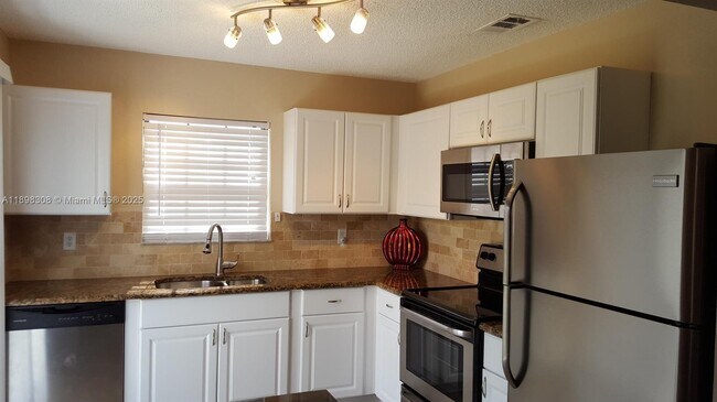 Building Photo - 1301 SE Carrington Ct