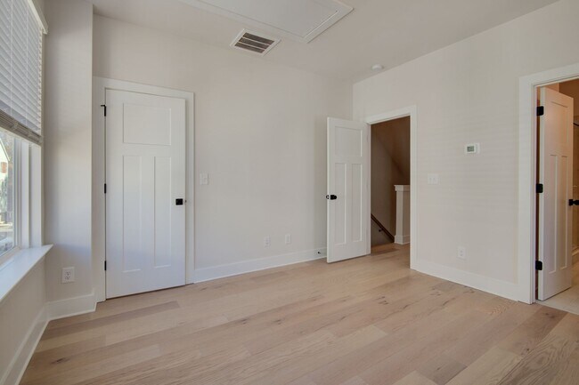 Building Photo - COMING SOON! Modern End-Unit Living Near Uptown | Rooftop Terrace + Tandem Garage