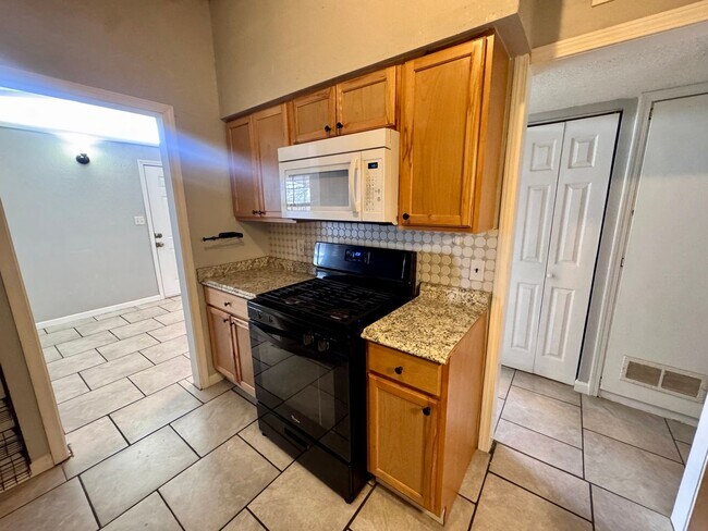 Building Photo - Charming 3-bedroom, 1-bath home featuring an attached carport and a fully fenced backyard—perfect...