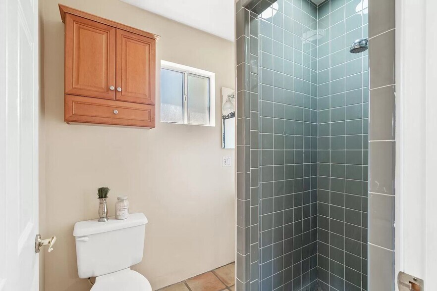 Guest house shower with italian tile - 14024 Peach Grove St