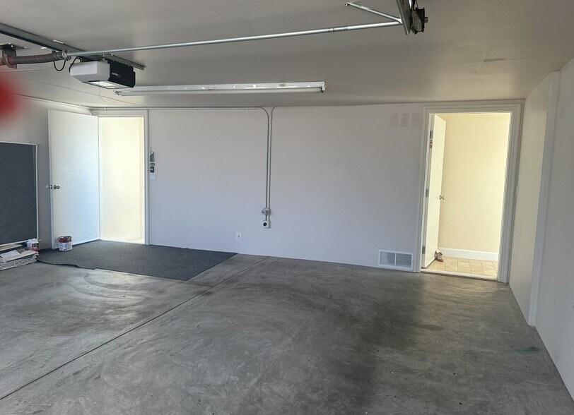 Private 2-car garage features 240v EV charging stations, electric door opener - 8120 Billowvista Dr