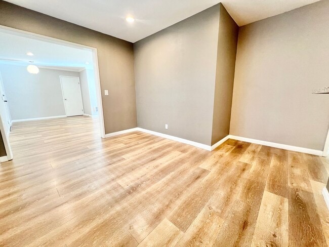 Building Photo - Contemporary 2 Bed Condo with 2 Garage Parking Spaces, Community Pool, and 3 Private Balconies