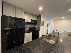 Building Photo - MOVE-IN READY 1+1 w/gated entry, 2 parking spaces + pool!