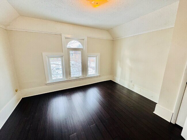 Building Photo - "Spacious 6-Bedroom Gem with Gleaming New Hardwood Floors in Minneapolis!"