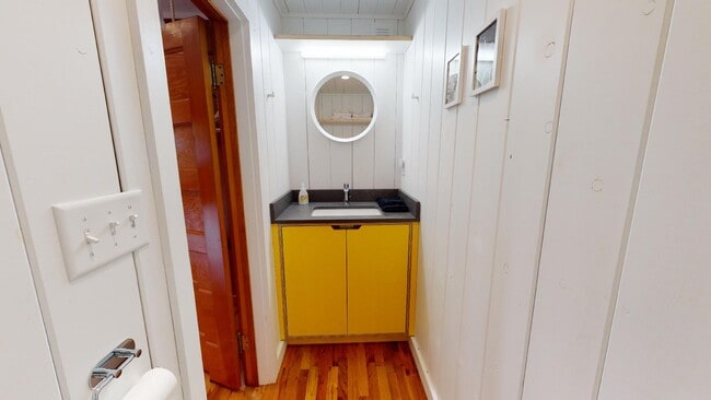 Upstairs bedroom #1 half bath with vanity and toilet - 2304 Pine Street