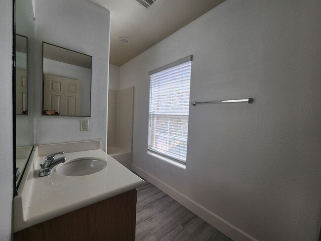 Building Photo - Sleek 2 story home with tile in most living areas and upgraded kitchen.