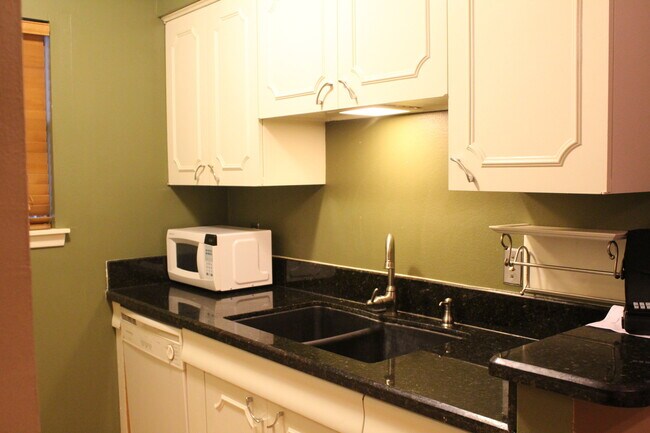 Building Photo - *COMING SOON* MOVE IN SPEICAL Upstairs Condo with Premium Amenities & Hardwood Floors!