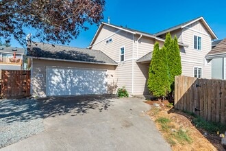Building Photo - Spacious 4-Bedroom Home with Cozy Backyard...