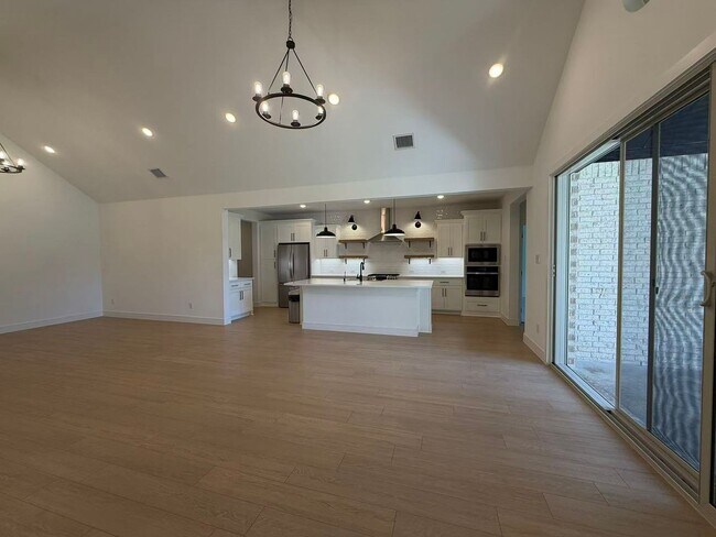 Building Photo - Move-in ready and like-new! Washer, dryer, and refrigerator Included.