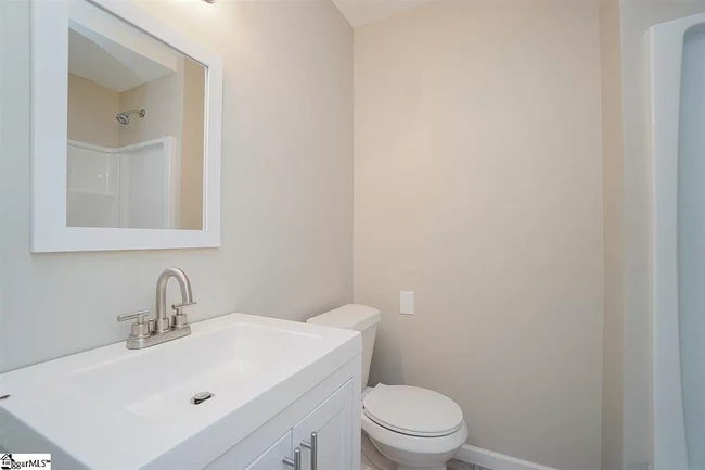 Hall bathroom with full-sized tub shower. - 1 Bent Twig Dr