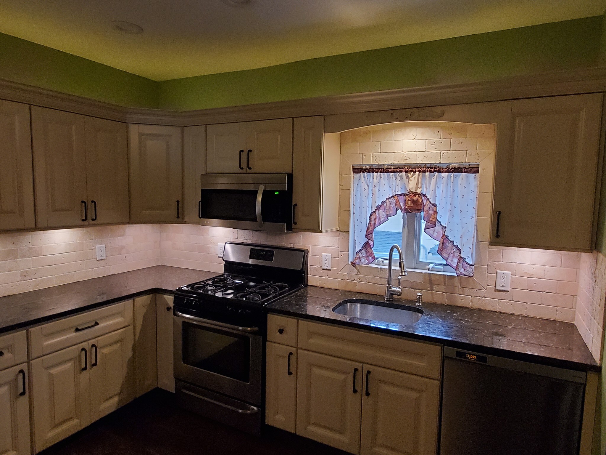 Under / over lighting with high hat can light - 78 S Carll Ave