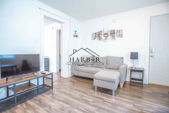 Building Photo - Modern Minimalism: Efficient 1-BR in a Top-Tier Location