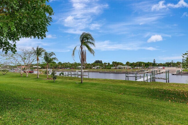 Building Photo - A BOATER'S PARADISE WITH THIS STUNNING 3 BEDROOM, 2 BATH WATERFRONT POOL HOME W/DOCK & BOAT LIFT ...